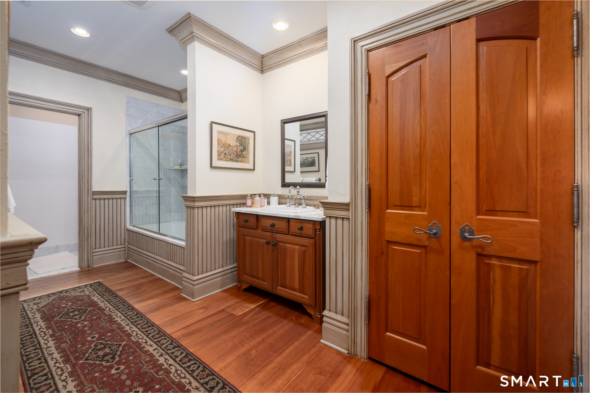 7 Equestrian Ridge Newtown, CT 06470 - Photo 33 of 40 a spacious bathroom with a sink and a mirror