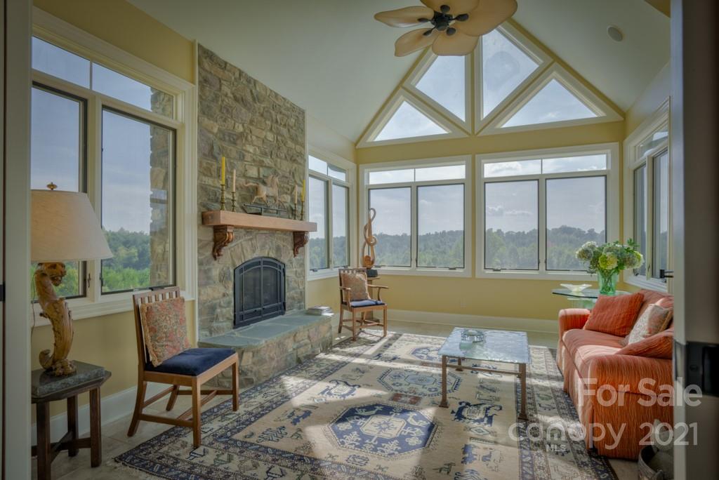874-a R A R Thompson Road, Unit 24 Mill Spring, NC 28756 - Photo 16 of 47 a living room with furniture and a fireplace