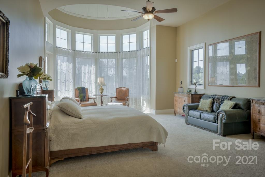 874-a R A R Thompson Road, Unit 24 Mill Spring, NC 28756 - Photo 17 of 47 a bedroom with a bed couch and windows