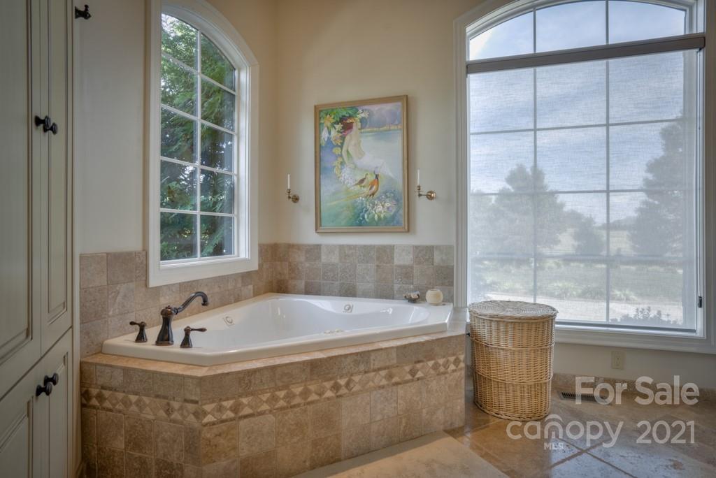 874-a R A R Thompson Road, Unit 24 Mill Spring, NC 28756 - Photo 20 of 47 a bathroom with bathtub and window
