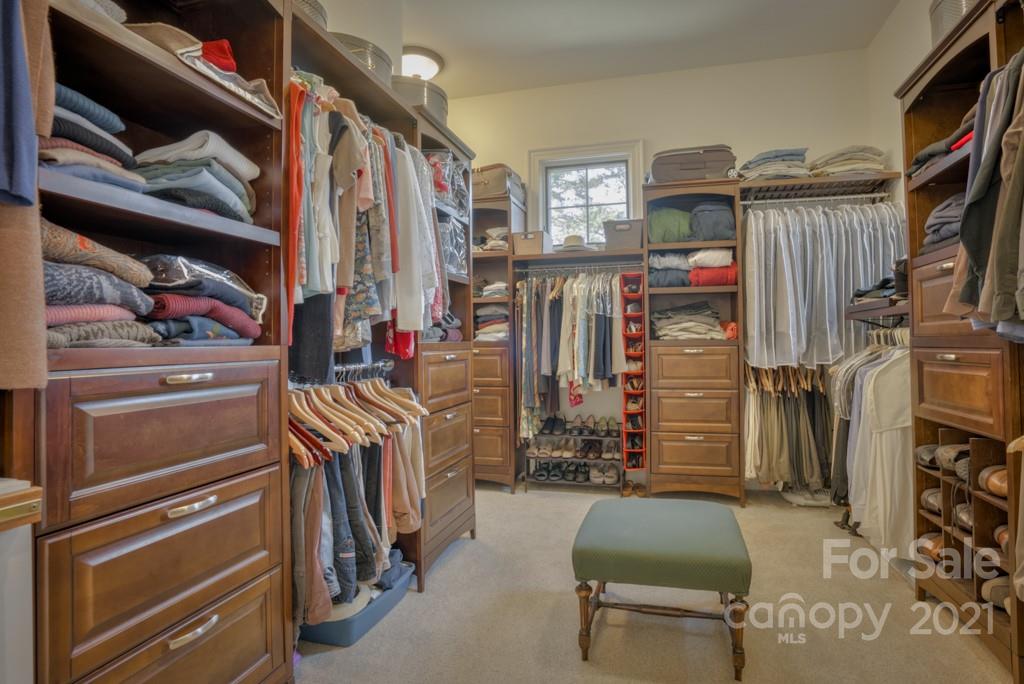 874-a R A R Thompson Road, Unit 24 Mill Spring, NC 28756 - Photo 21 of 47 a view of walk in closet with clothes and shoes