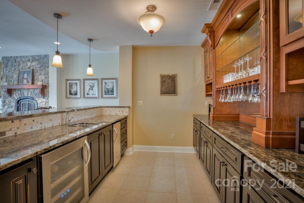 874-a R A R Thompson Road, Unit 24 Mill Spring, NC 28756 - Photo 24 of 47 a kitchen with stainless steel appliances granite countertop a sink and a wooden floors