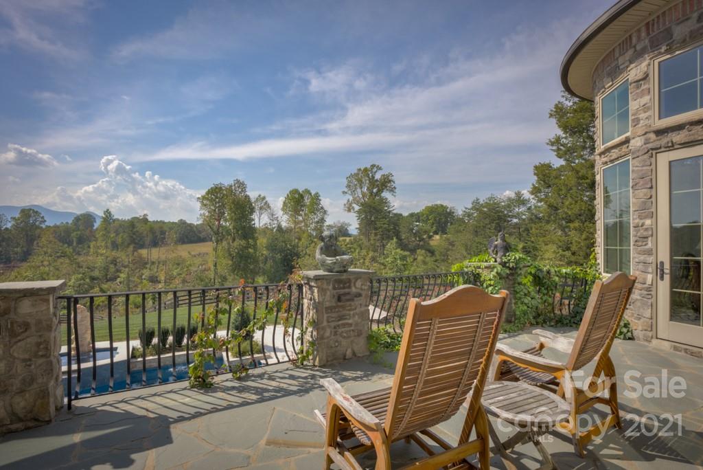 874-a R A R Thompson Road, Unit 24 Mill Spring, NC 28756 - Photo 6 of 47 a view of a chairs and table in patio