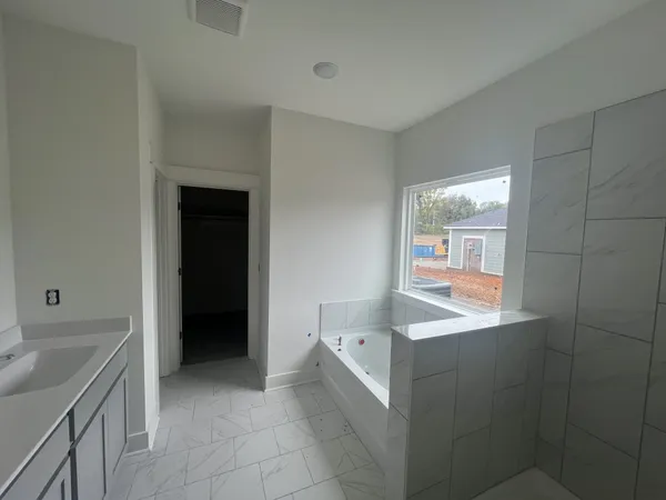 a kitchen with a sink and a refrigerator