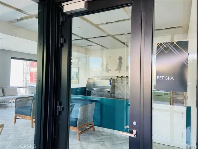 a bathroom with a glass shower door and a sink