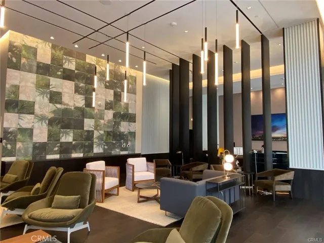 a living room with furniture and a lamp