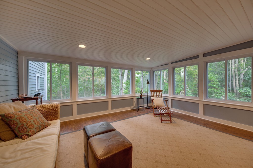 131 Bolton Road Harvard, MA 01451 - Photo 13 of 30 a living room with furniture and large windows