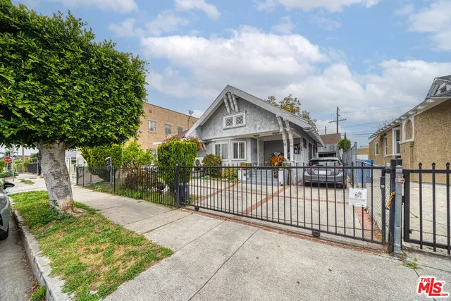 a view of a wrought iron fences in front of house