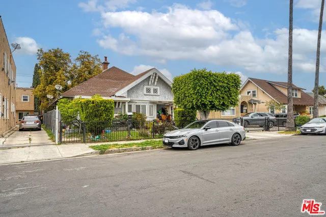 a view of street with parked cars