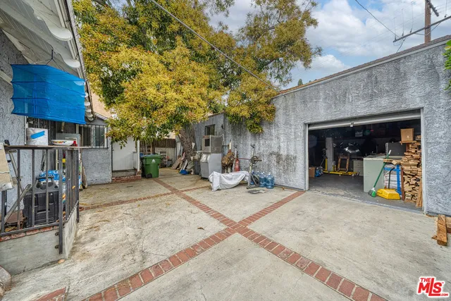 a view of a chairs and table in the patio