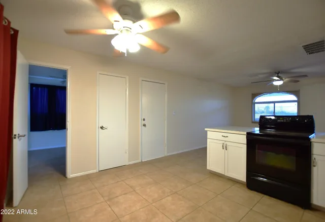 a view of a kitchen with a sink and a fireplace