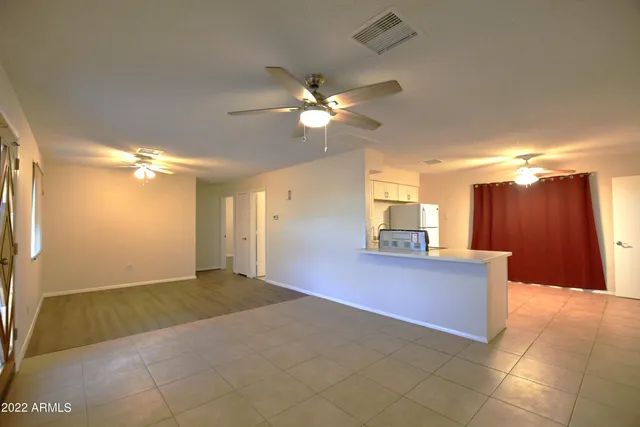a view of a kitchen with a sink and a cabinet