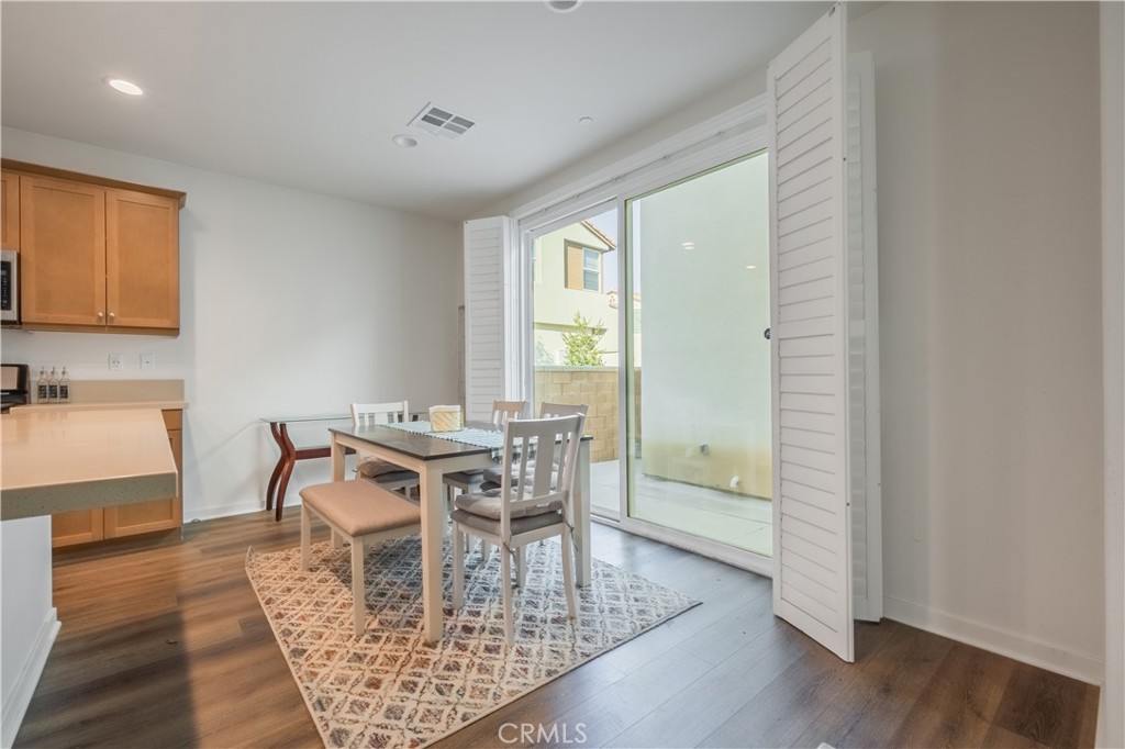 9513 Retreat Place Rancho Cucamonga, CA 91730 - Photo 14 of 49 a view of a dining room with furniture and wooden floor
