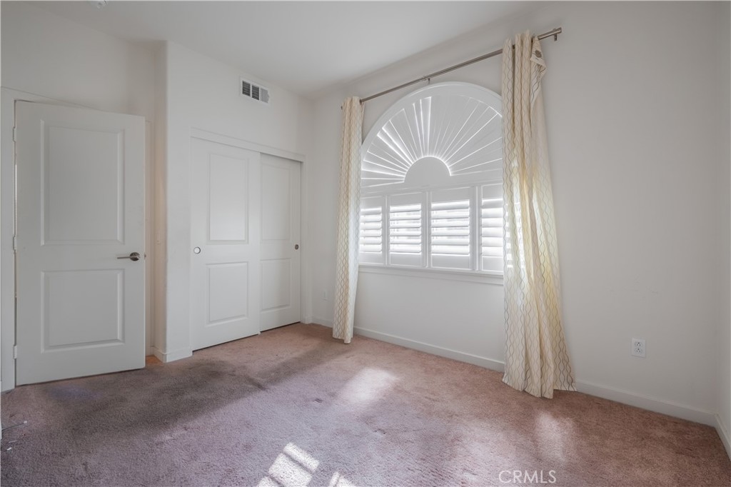 9513 Retreat Place Rancho Cucamonga, CA 91730 - Photo 16 of 49 an empty room with windows