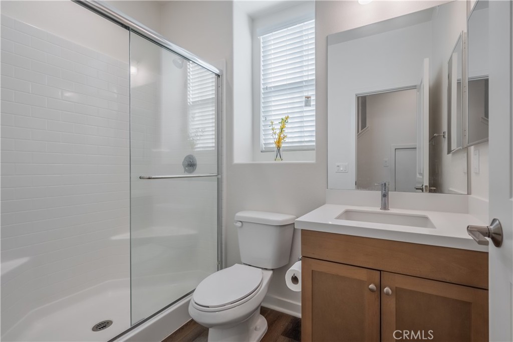 9513 Retreat Place Rancho Cucamonga, CA 91730 - Photo 17 of 49 a bathroom with a sink toilet vanity and shower