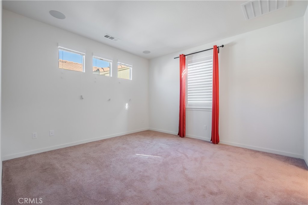 9513 Retreat Place Rancho Cucamonga, CA 91730 - Photo 18 of 49 a view of an empty room with a window