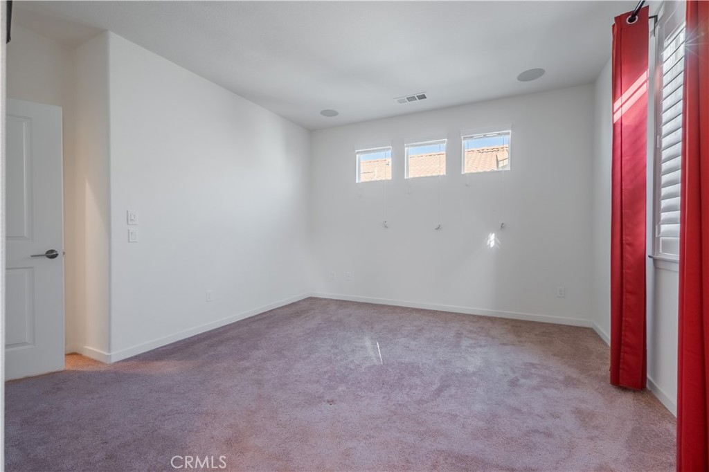 9513 Retreat Place Rancho Cucamonga, CA 91730 - Photo 20 of 49 an empty room with windows