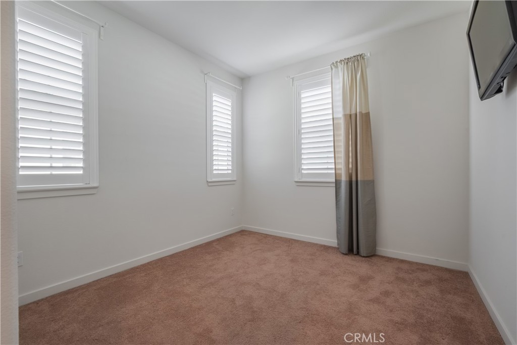 9513 Retreat Place Rancho Cucamonga, CA 91730 - Photo 24 of 49 an empty room with windows