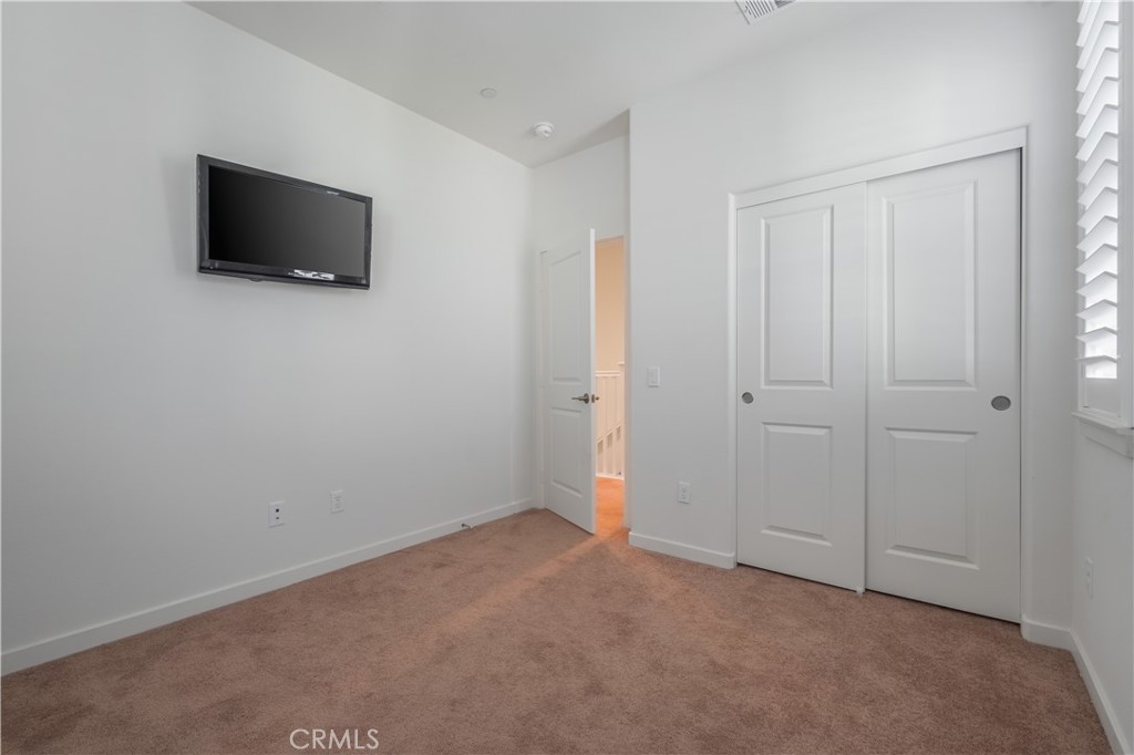 9513 Retreat Place Rancho Cucamonga, CA 91730 - Photo 25 of 49 a view of a livingroom with a flat screen tv