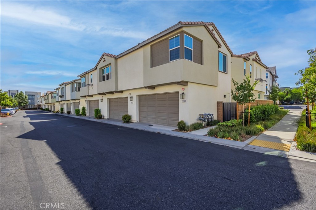 9513 Retreat Place Rancho Cucamonga, CA 91730 - Photo 35 of 49 a view of a house with a street