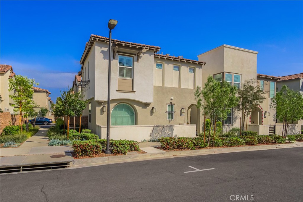 9513 Retreat Place Rancho Cucamonga, CA 91730 - Photo 40 of 49 front view of a house with a street