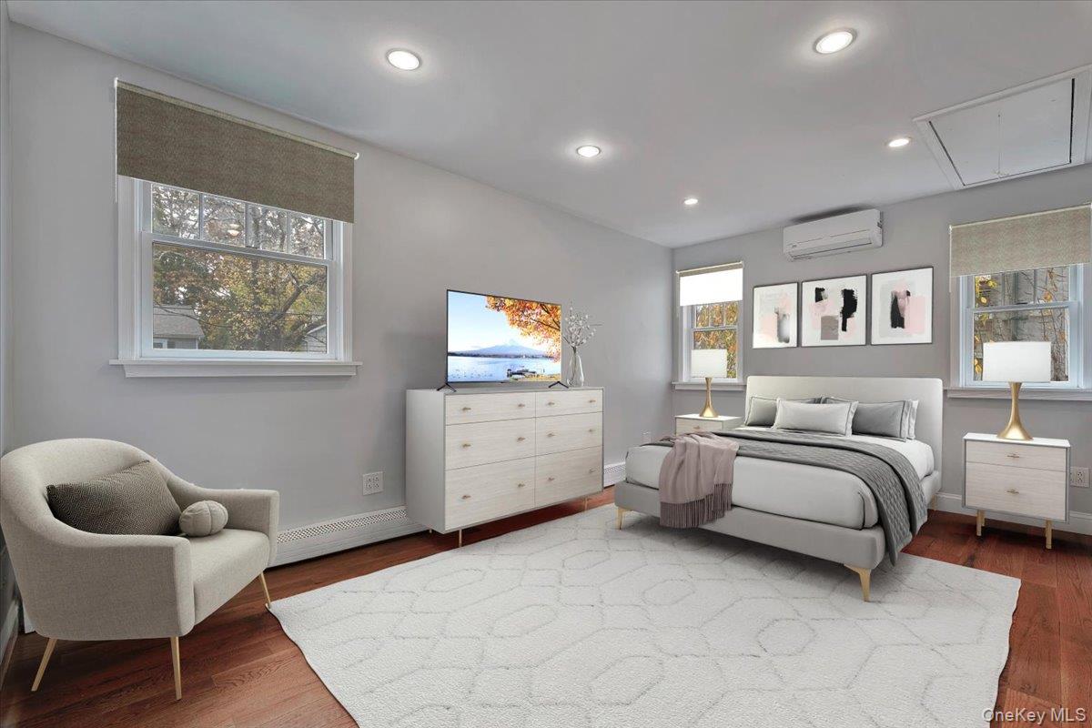 193 Nelson Road Scarsdale, NY 10583 - Photo 26 of 37 a spacious bedroom with a bed and a couch
