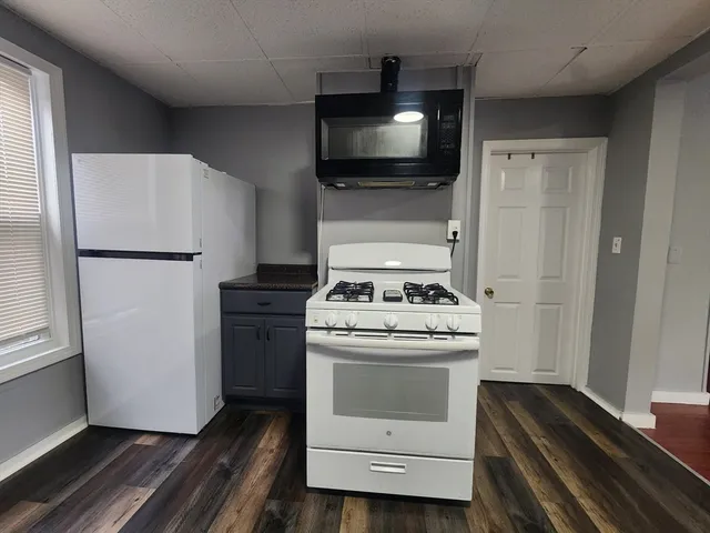 a kitchen with a stove and a refrigerator
