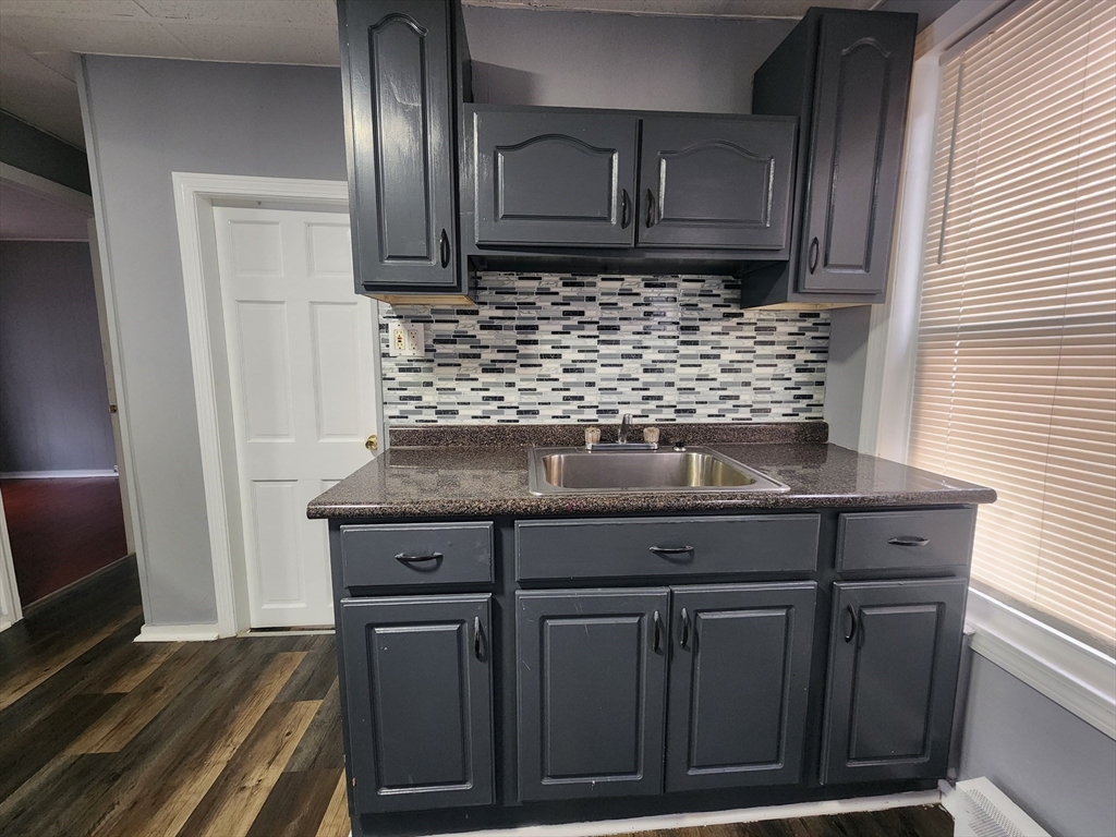 7 Pleasant Terrace, Unit 1 Worcester, MA 01609 - Photo 3 of 10 a view of cabinets with wooden floor