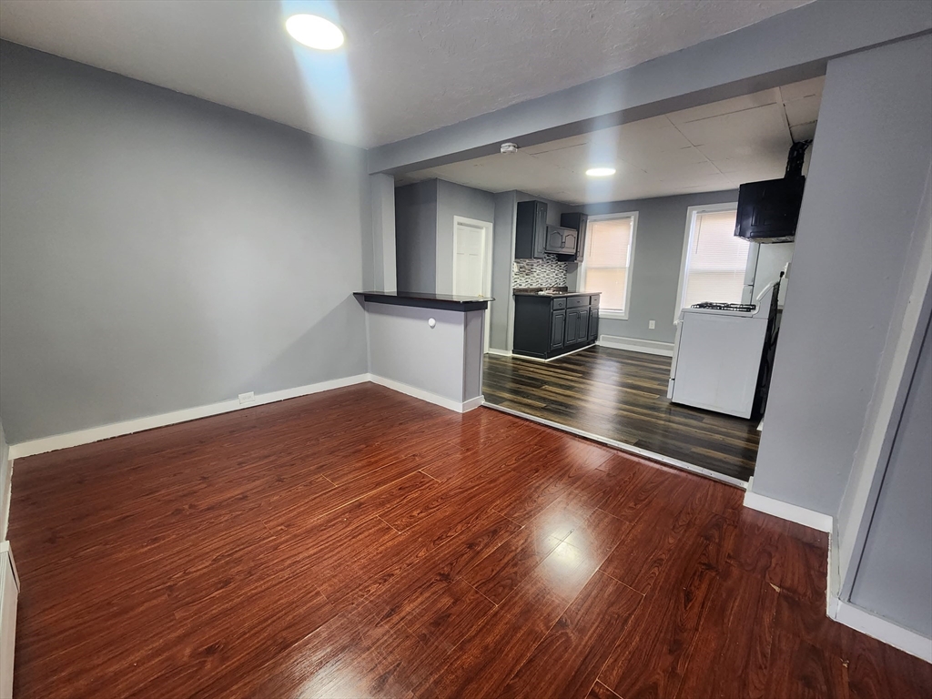 7 Pleasant Terrace, Unit 1 Worcester, MA 01609 - Photo 8 of 10 a view of kitchen with cabinets and wooden floor
