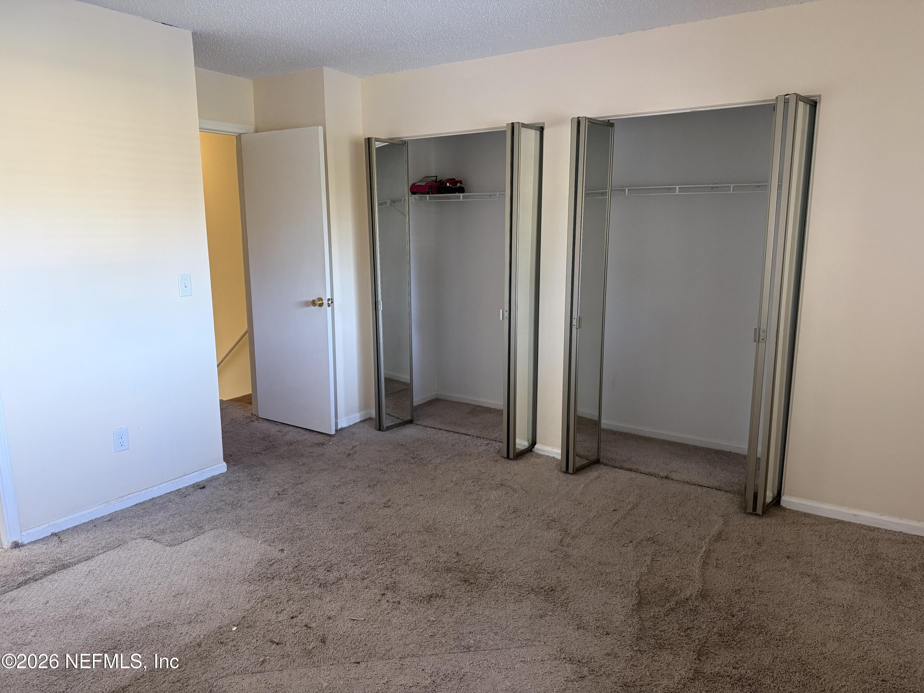 3801 Crown Point Road, Unit 2093 Jacksonville, FL 32257 - Photo 12 of 17 an empty room with closet and a bathroom