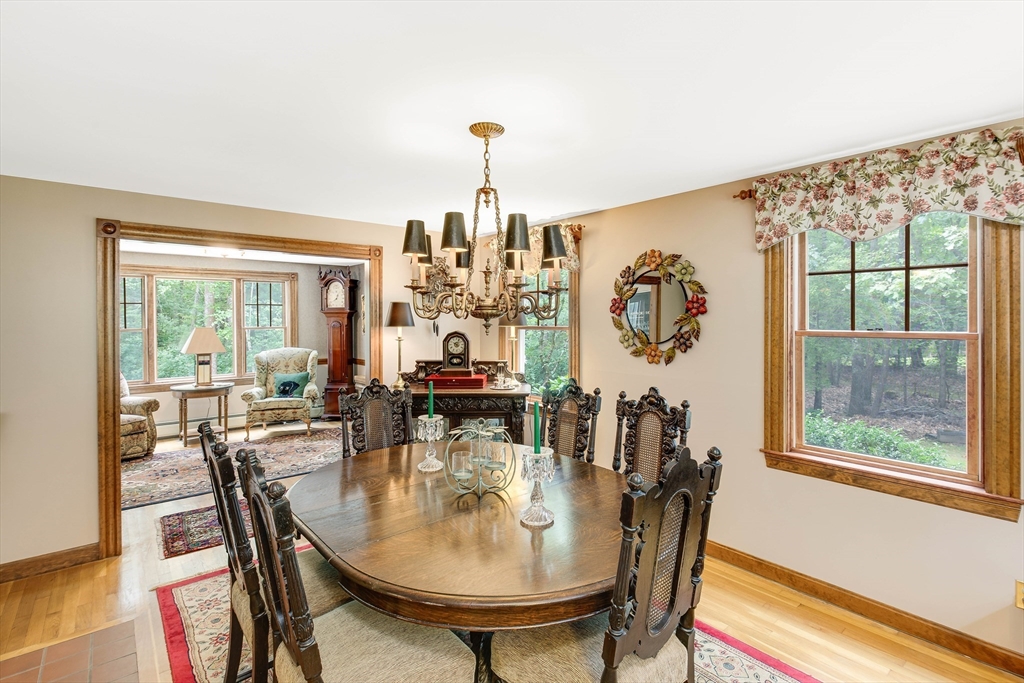 156 Newbury Road Rowley, MA 01969 - Photo 14 of 41 a dining room with furniture a chandelier and window