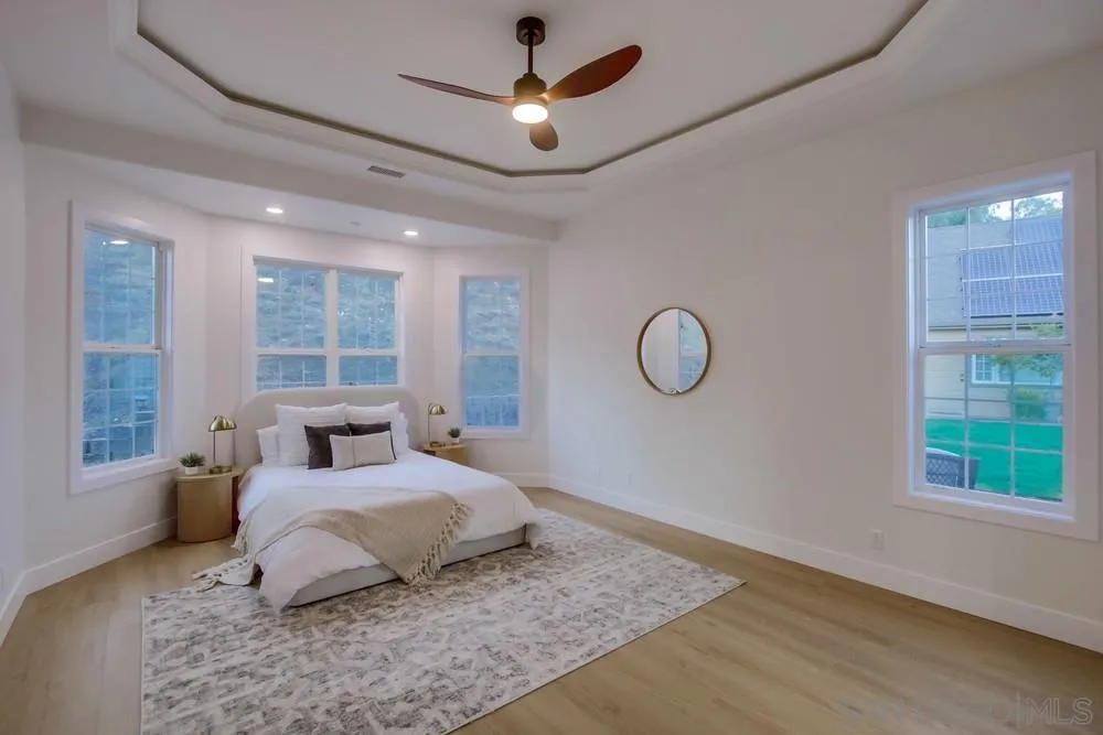 2543 Daisy Lane Fallbrook, CA 92028 - Photo 12 of 74 a bedroom with a bed dresser and a window