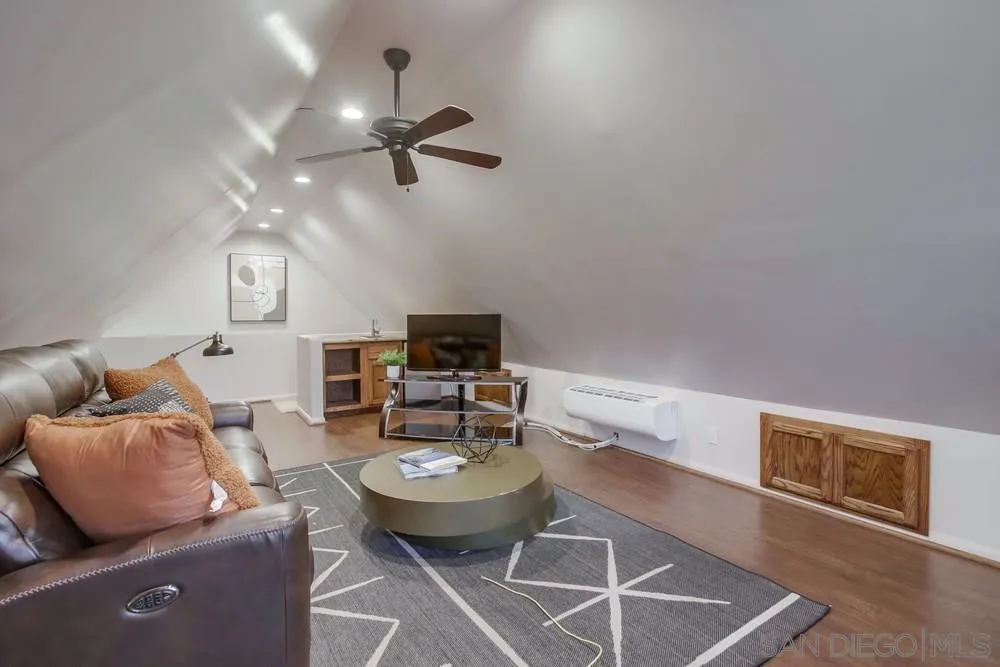 2543 Daisy Lane Fallbrook, CA 92028 - Photo 22 of 74 a living room with furniture a flat screen tv and kitchen view
