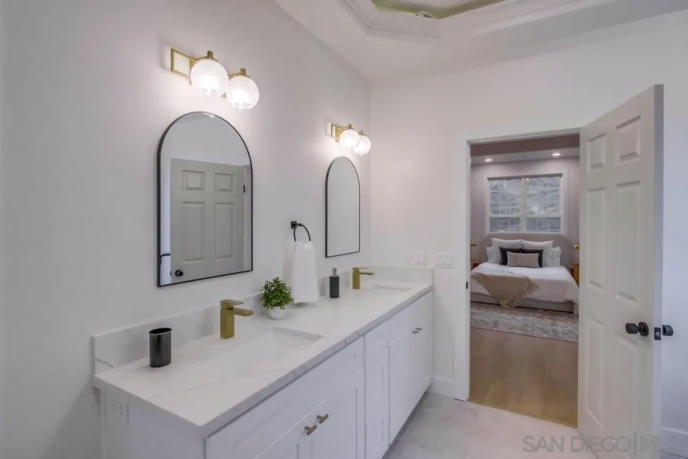 2543 Daisy Lane Fallbrook, CA 92028 - Photo 45 of 74 a bathroom with double vanity sinks and a mirror
