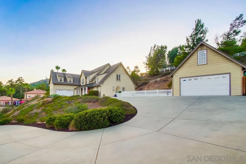 2543 Daisy Lane Fallbrook, CA 92028 - Photo 66 of 74 a view of a house with a yard and garage