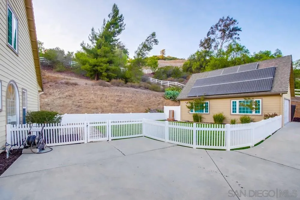 2543 Daisy Lane Fallbrook, CA 92028 - Photo 69 of 74 a view of a house with a porch and potted plants