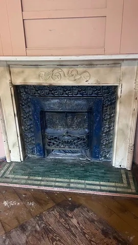 a view of fireplace and wooden floor