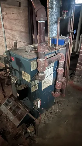 a living room with fireplace furniture and a flat screen tv