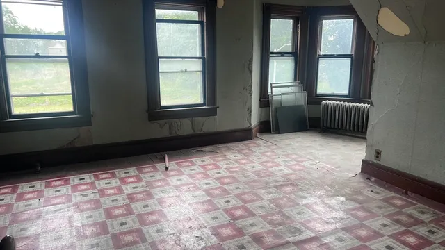 a view of an empty room and window