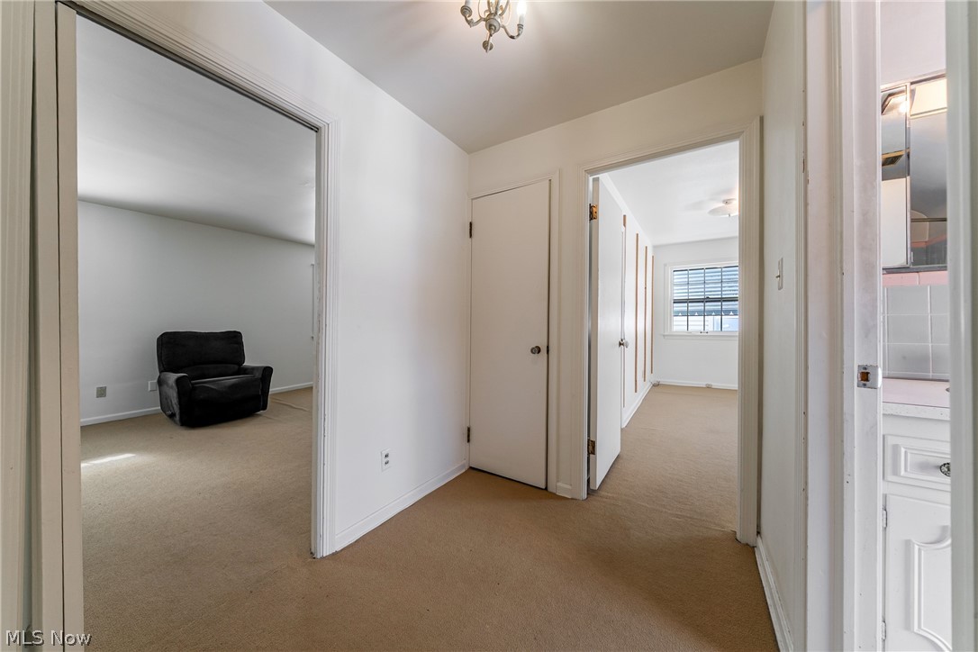 4602 College Road South Euclid, OH 44121 - Photo 12 of 26 Corridor featuring light colored carpet and baseboards