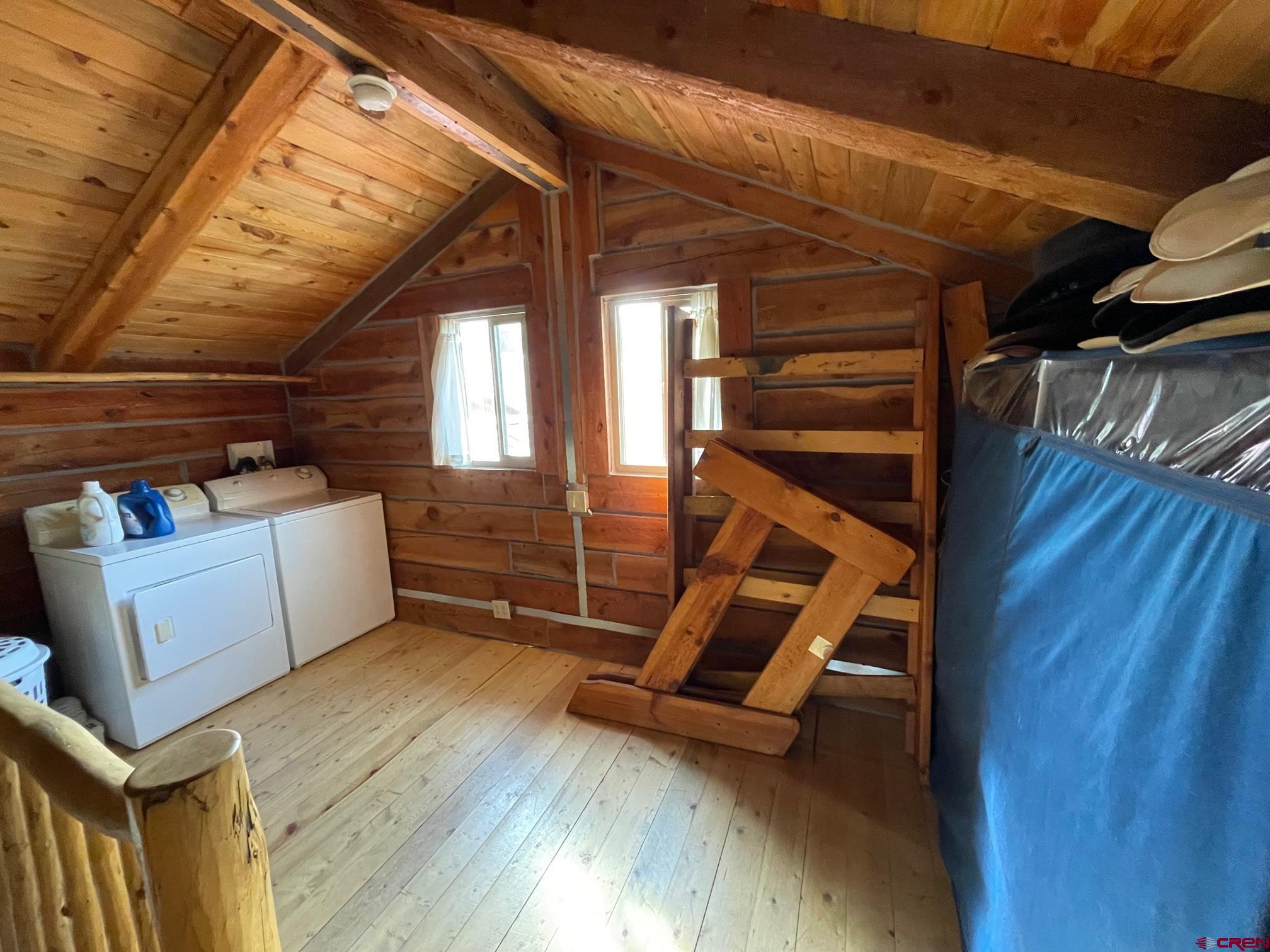 417 State Street Pitkin, CO 81241 - Photo 13 of 23 a view of an empty room with wooden floor and a window