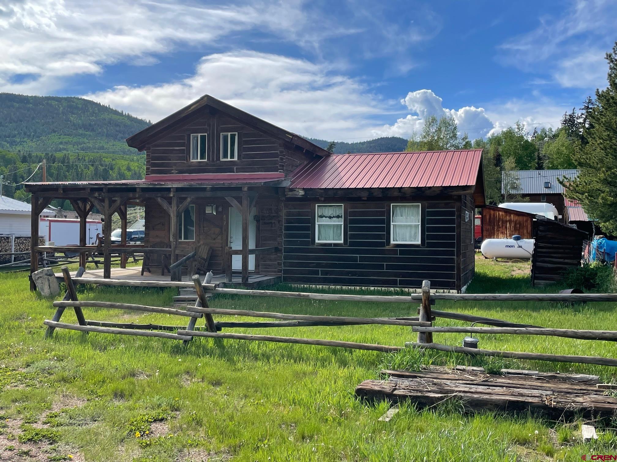 417 State Street Pitkin, CO 81241 - Photo 2 of 23 a front view of a house with a garden