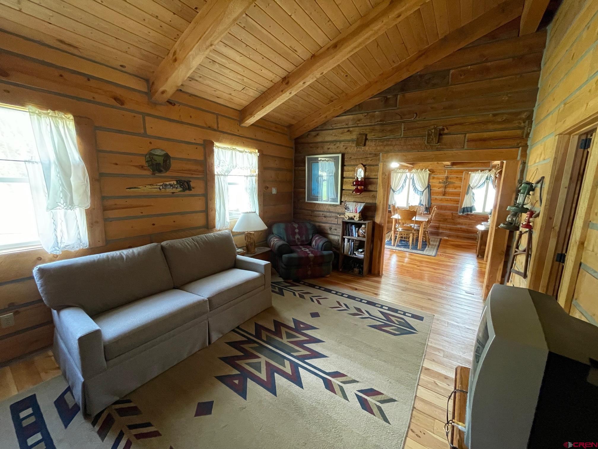417 State Street Pitkin, CO 81241 - Photo 9 of 23 a living room with furniture and wooden floor