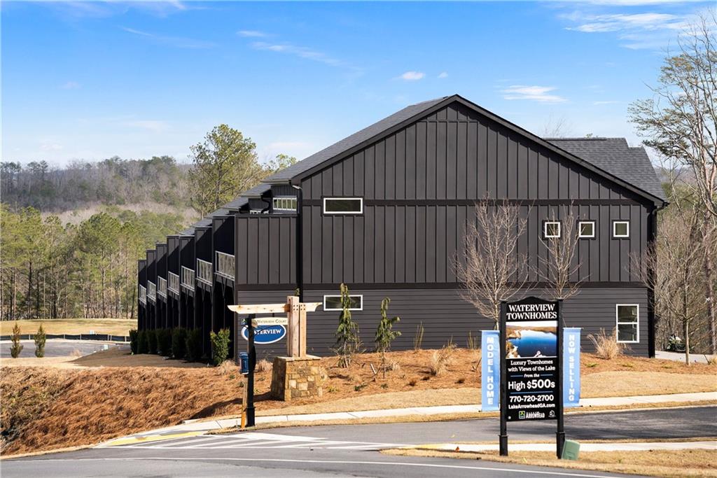 116 Waterview Court Waleska, GA 30183 - Photo 18 of 37 a street view with wooden fence and trees
