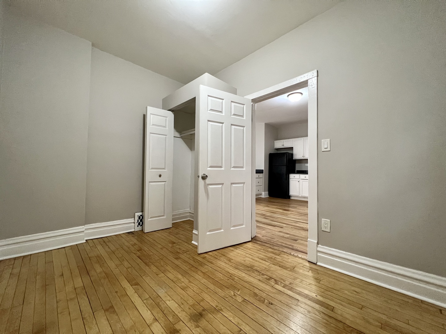 2203 South Ridgeway Avenue Chicago, IL 60623 - Photo 4 of 9 wooden floor in an empty room
