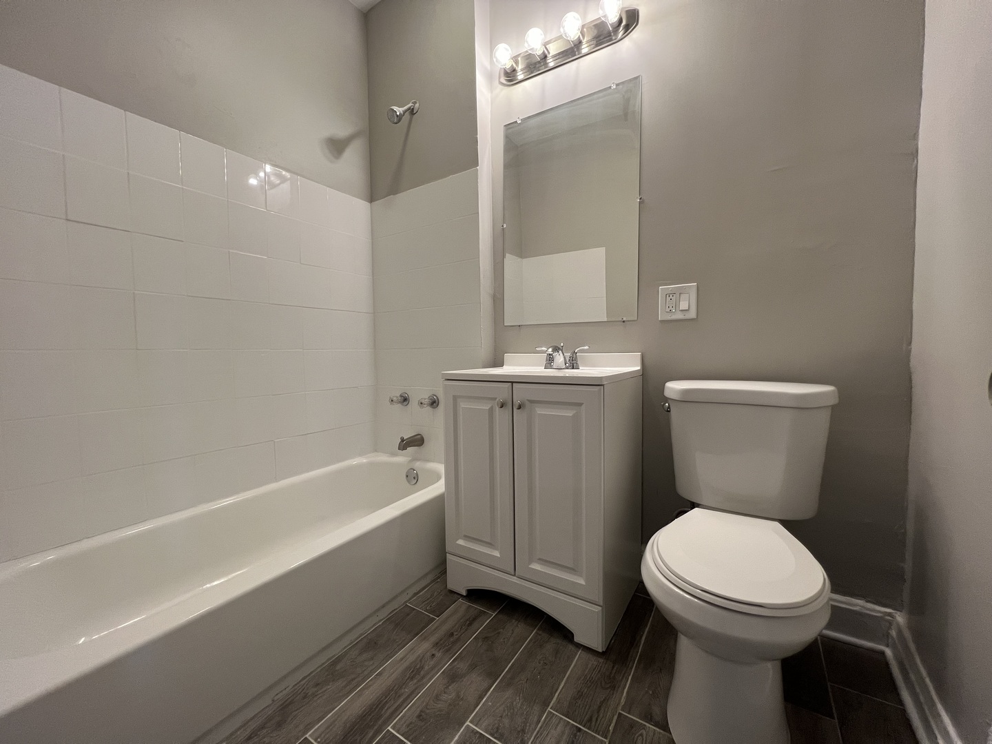 2203 South Ridgeway Avenue Chicago, IL 60623 - Photo 9 of 9 a bathroom with a toilet a sink and bathtub