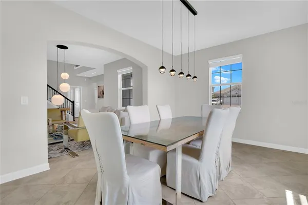 a dining room with furniture and window