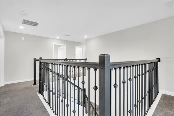 a view of a hallway with a window