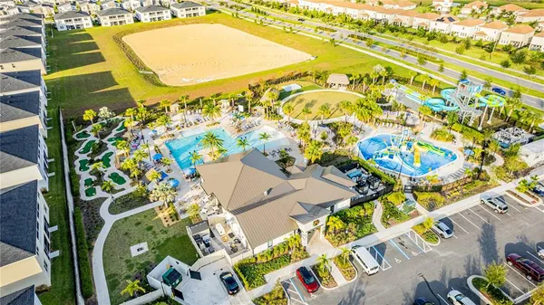 a view of a swimming pool with an outdoor seating and a yard