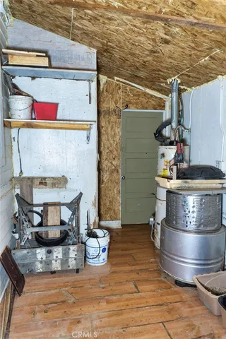 a view of washer and dryer with wooden floor